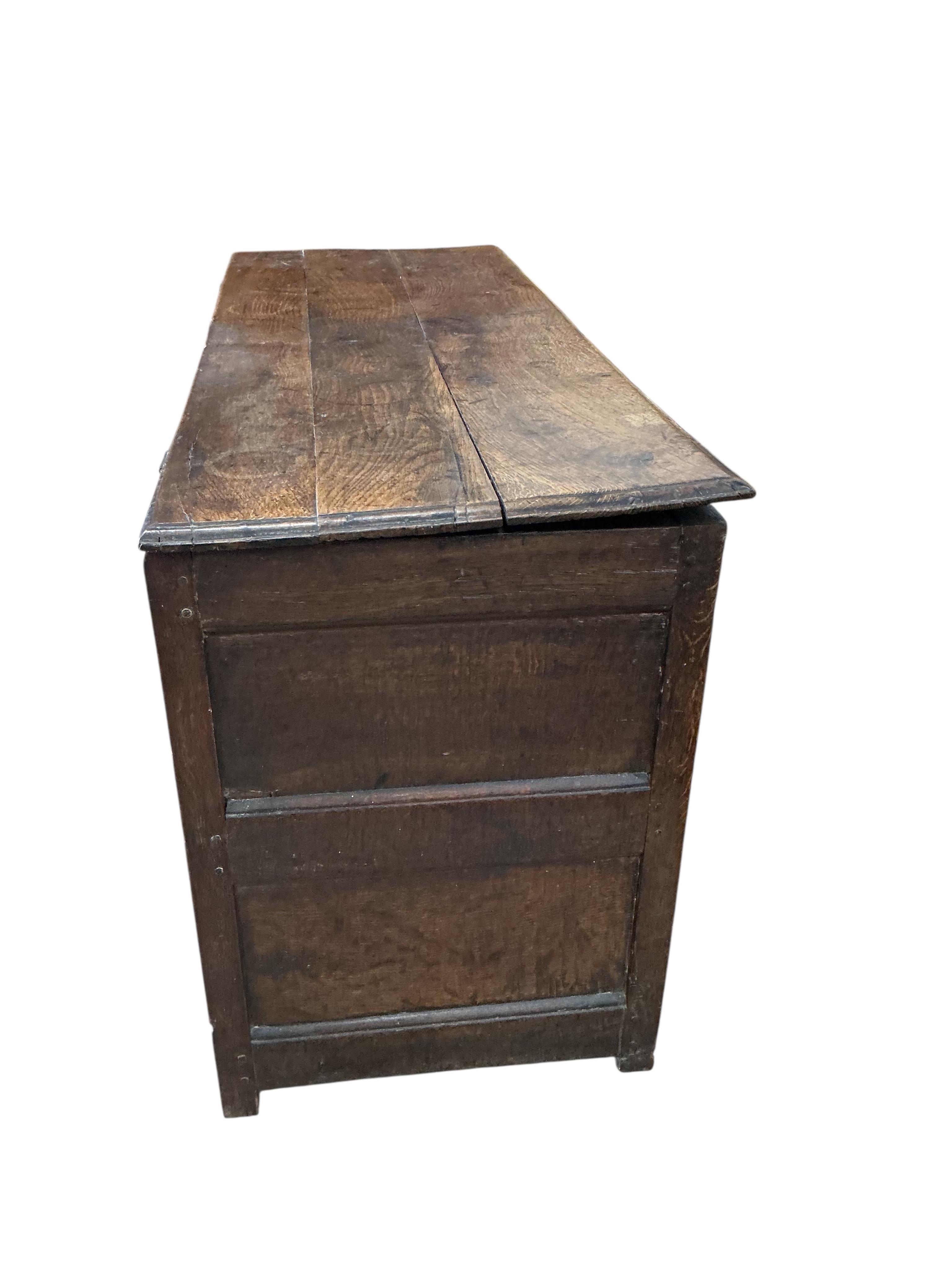 An early 18th century panelled oak mule chest, width 126cm, depth 48cm, height 68cm
